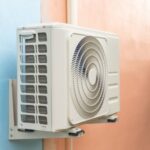 Technician performing AC maintenance in a Dubai vacation home to improve cooling efficiency and prevent breakdowns