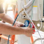 Outdoor AC compressor overheating during hot Dubai summer weather