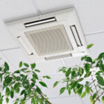 Technician inspecting centralized AC damper system in a large Dubai villa to fix uneven cooling