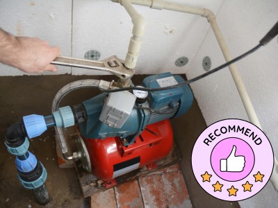 ProFix Dubai technician repairing a commercial water pump system in Al Quoz