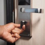 Homeowner struggling with door lock repair showing DIY mistake