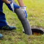 Professional drainage cleaning technician clearing blocked drains in Dubai