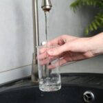 Technician checking water pump for low water pressure issue in Dubai villa