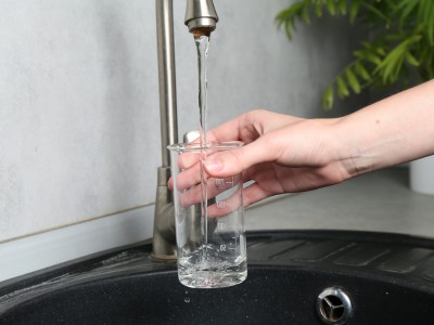 Technician checking water pump for low water pressure issue in Dubai villa
