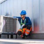 Professional AC technician performing maintenance service in Dubai