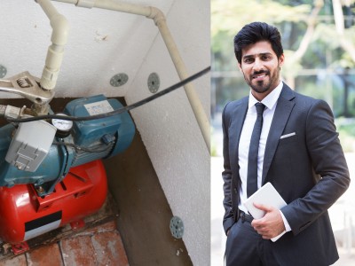 Technician fixing water pump system in Dubai home with tools during emergency repair