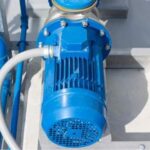 Technician repairing a water pump with no water flow in Dubai villa