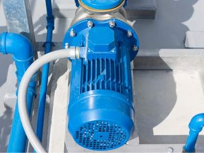 Technician repairing a water pump with no water flow in Dubai villa