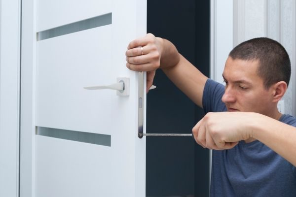 Locksmith fixing a door lock in Dubai