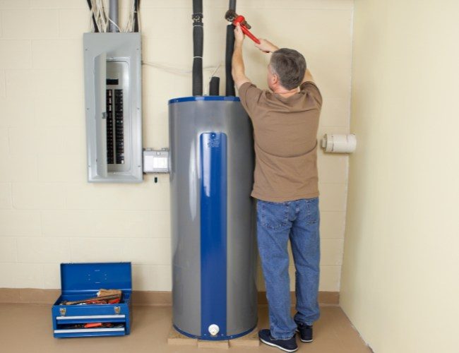 Plumber Fixing Water Heater in Dubai